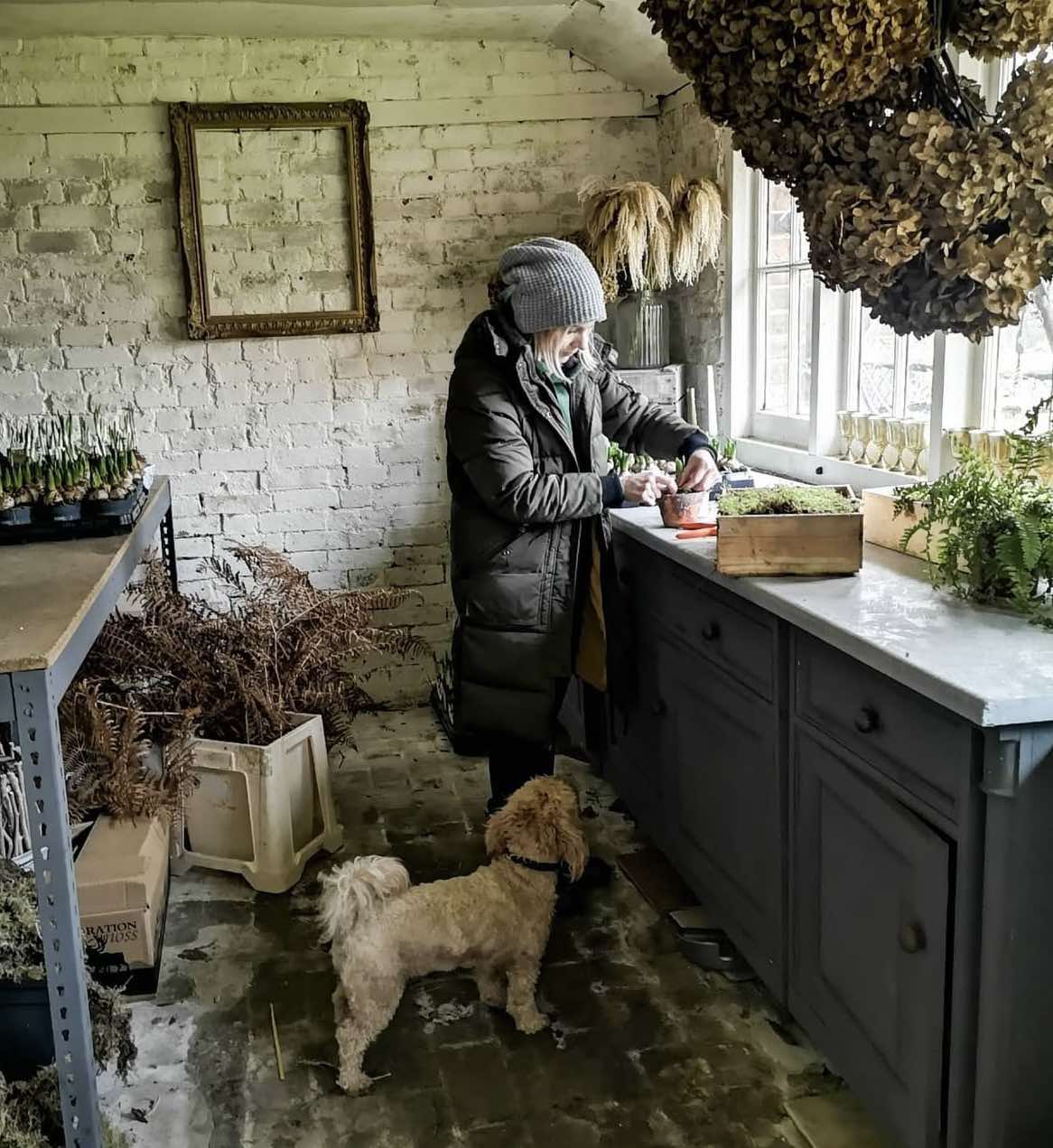 Kate Avery in The Little Flower School workshop with her dog