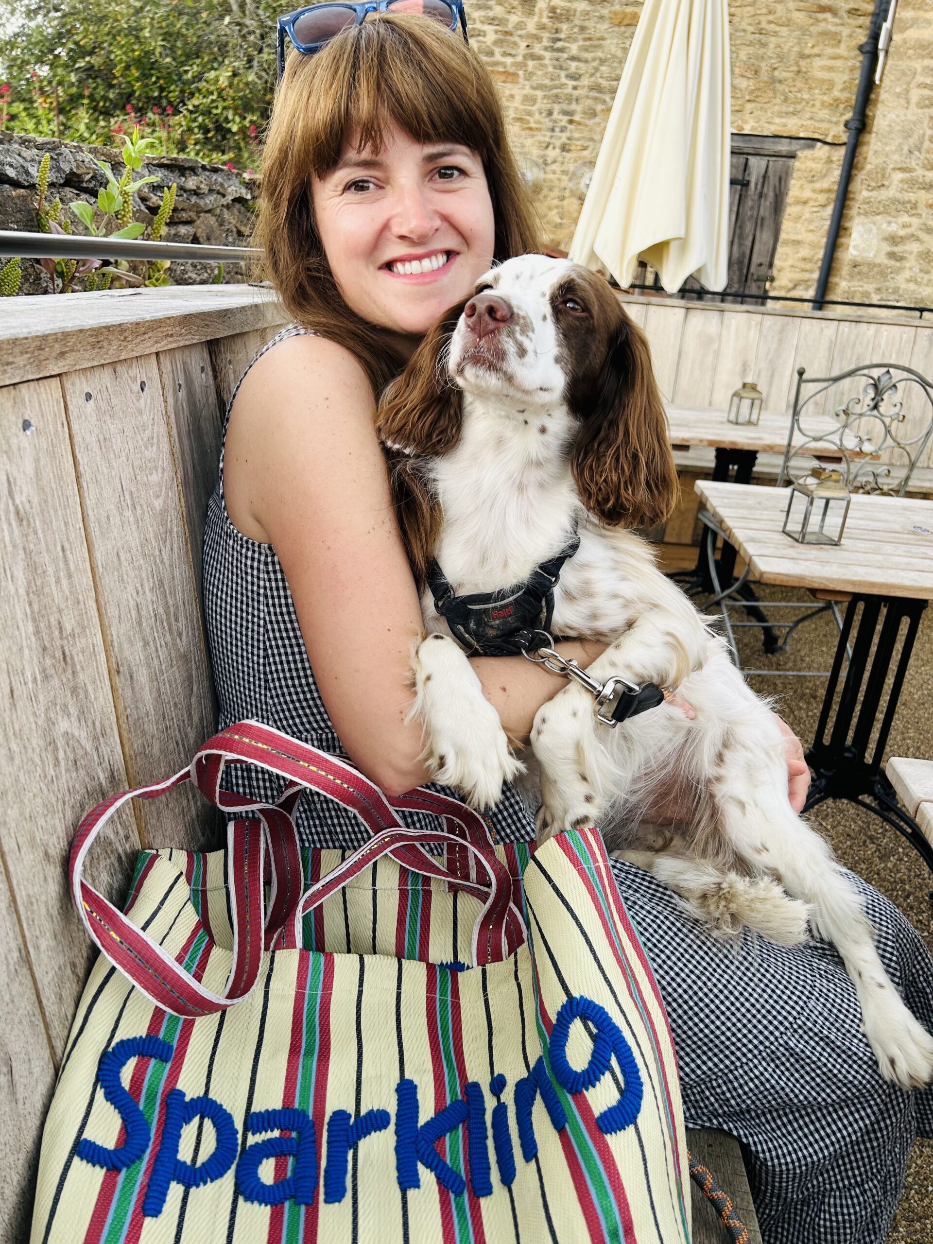 Kate from See+QUIN with a dog and one of her embroidered bags