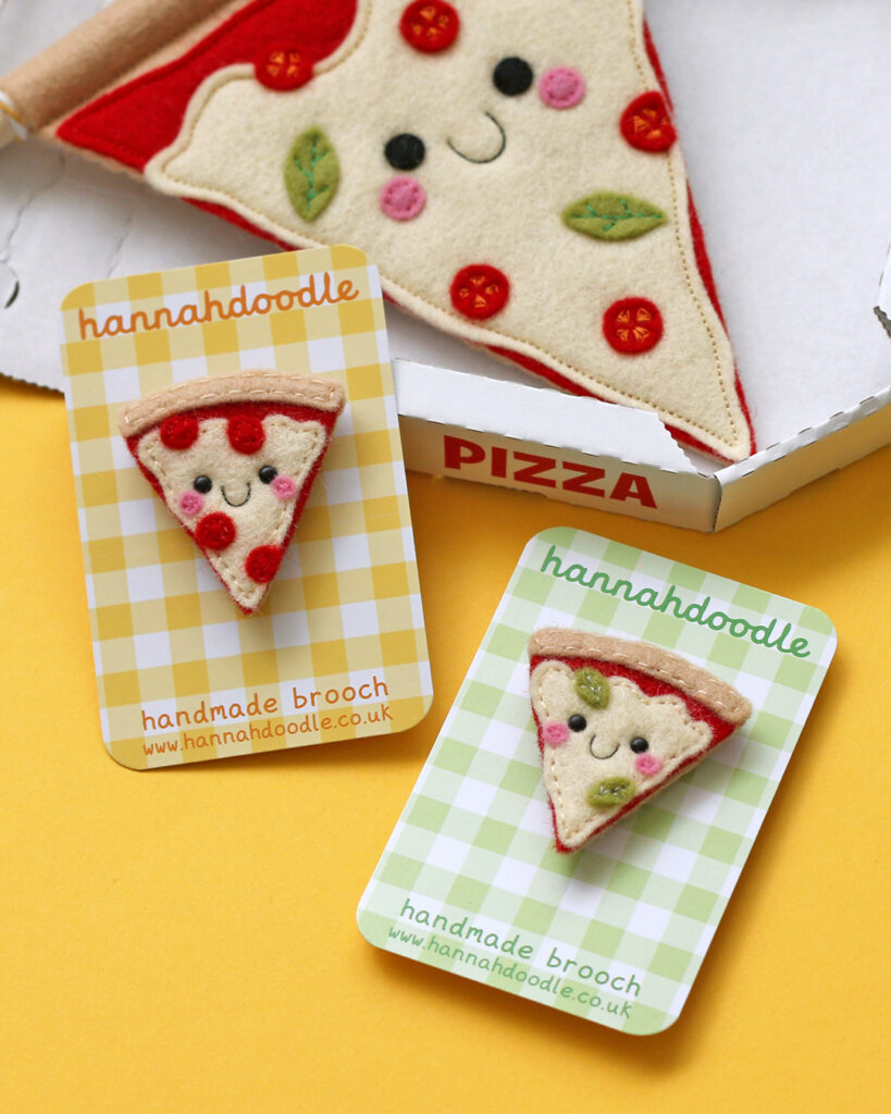 Some pizza slice brooches and a banner by hannahdoodle