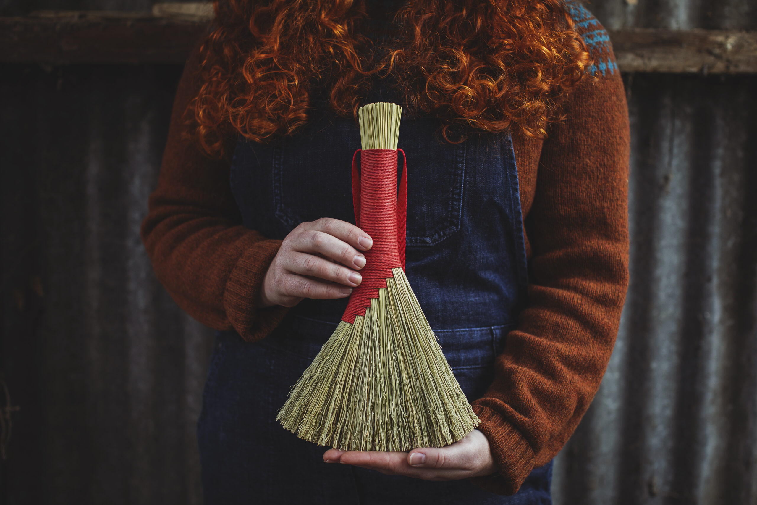 Rosa Harradine holding one of her handmade brushes