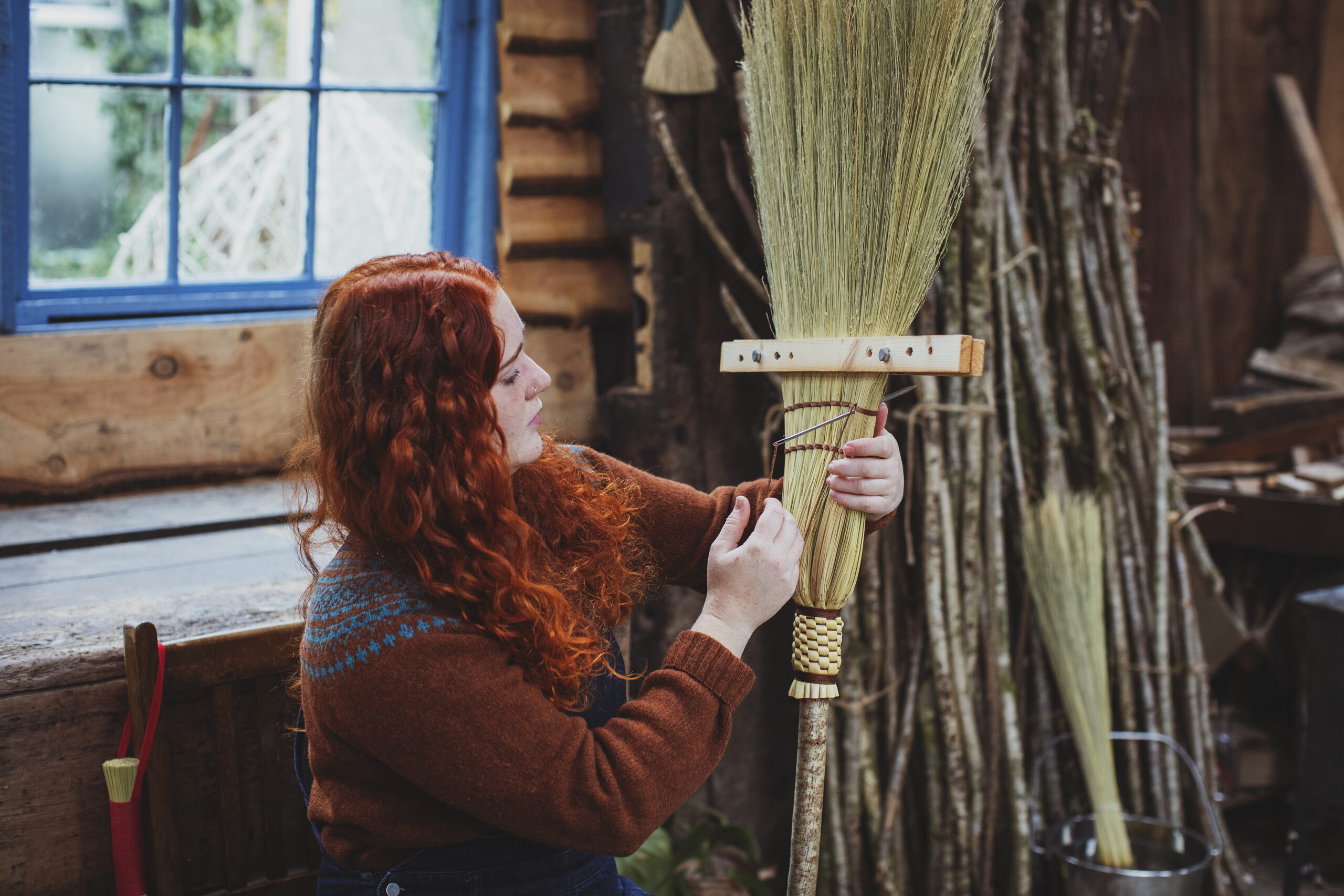 Rosa Harradine making one of her brooms
