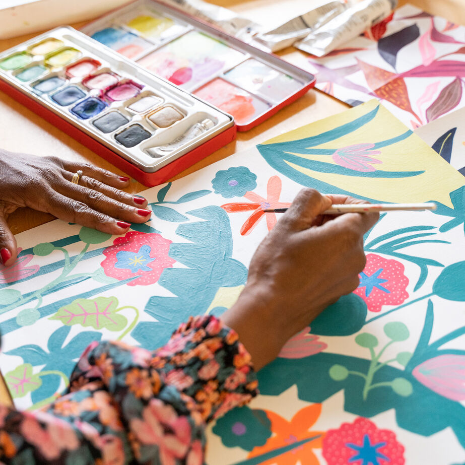 Jennie Fynn painting a colourful pattern design