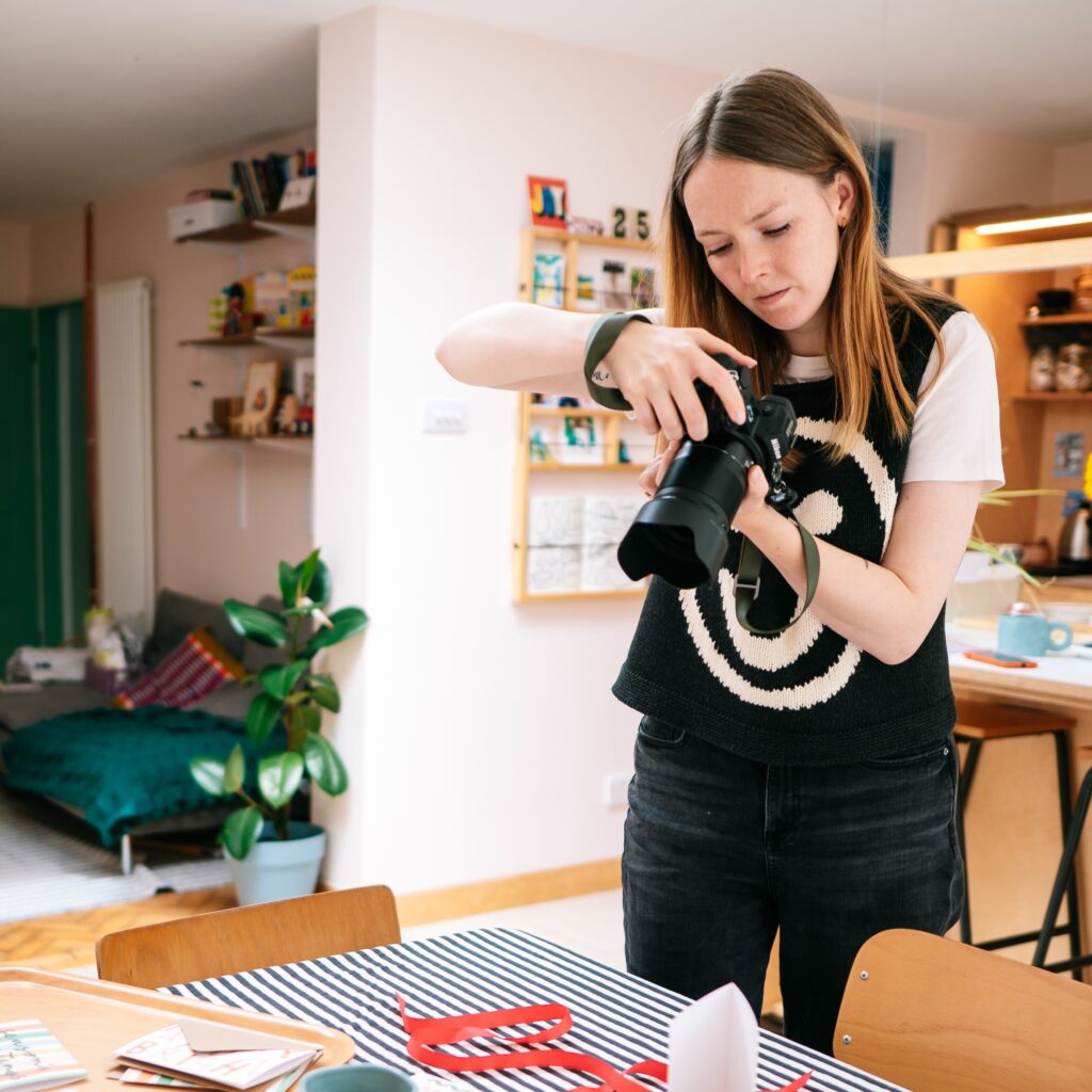 Holly from Holly Booth Studio, photographing a brand at work