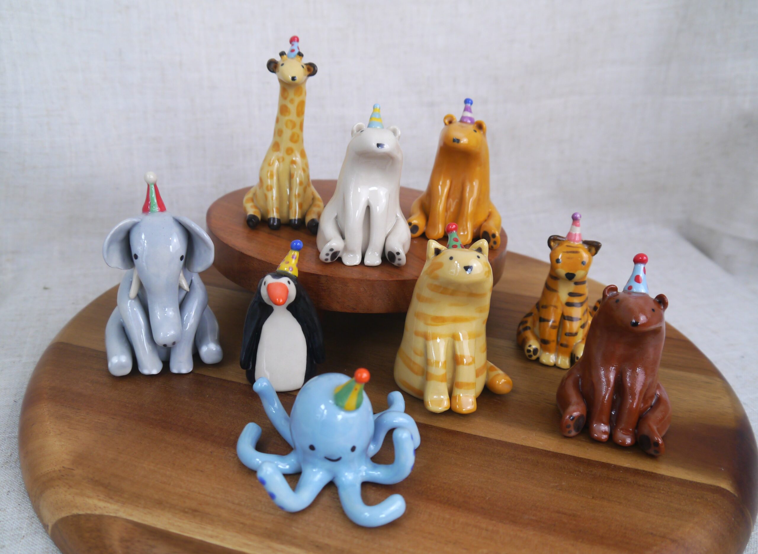 Whimsical ceramic animals with party hats by Millie's Ceramics
