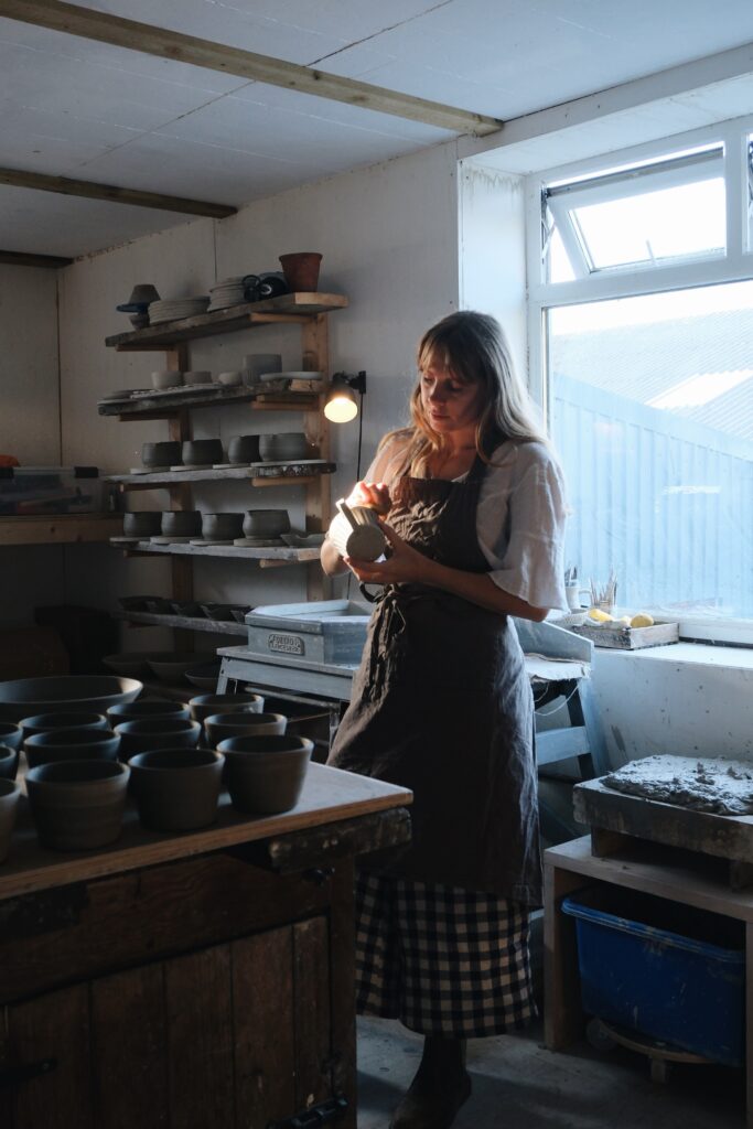 Hannah from Hannah Kinchin Ceramics in her pottery studio