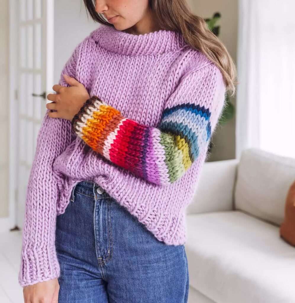 "Colour me remnants" jumper knitting kit by Lauren Aston Designs - with a pale purple body and a rainbow sleeve