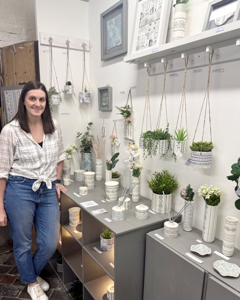 Alex Allday, ceramic and surface pattern designer, in her studio - surrounded by her intricately patterned pieces.