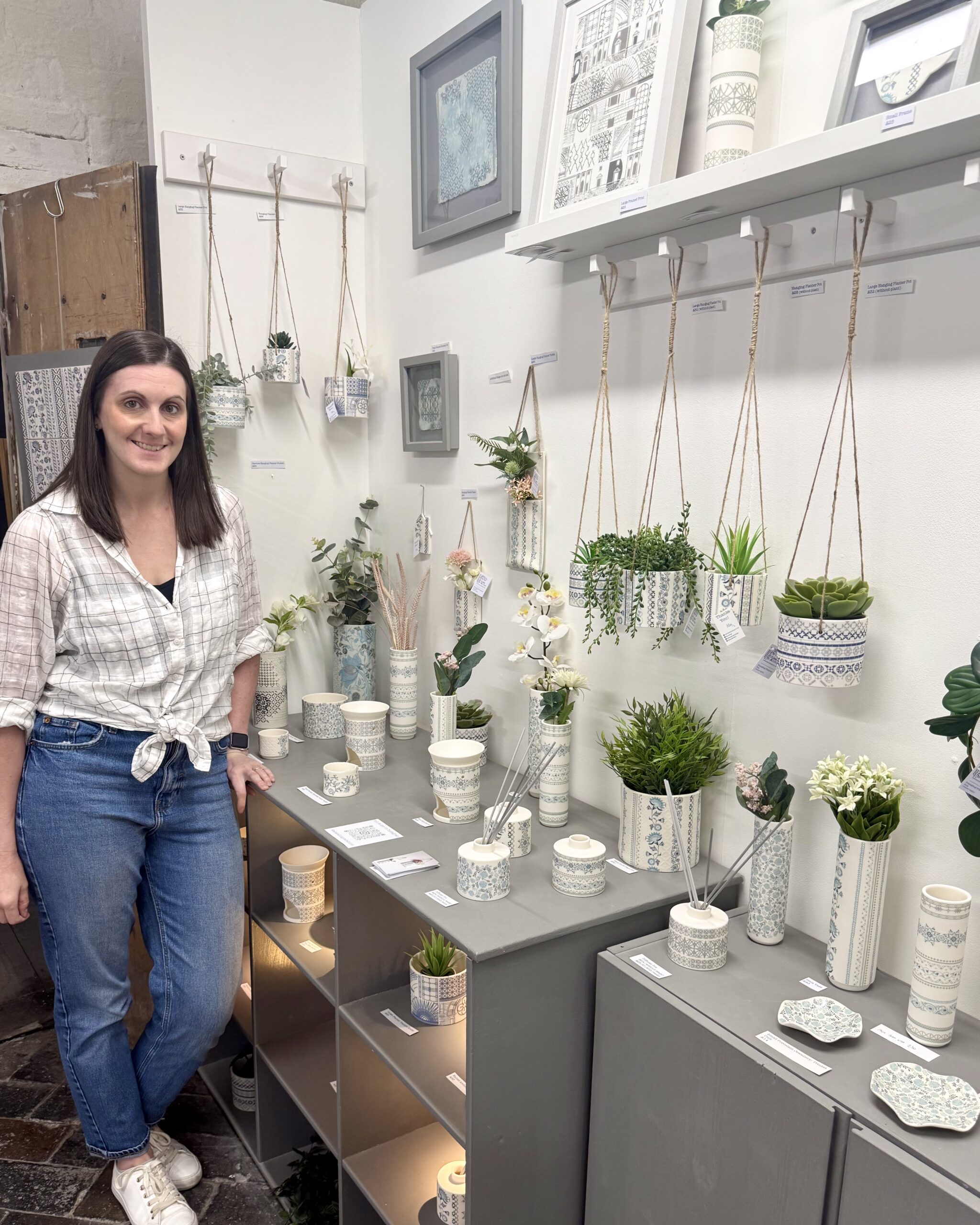 Alex Allday, ceramic and surface pattern designer, in her studio - surrounded by her intricately patterned pieces.