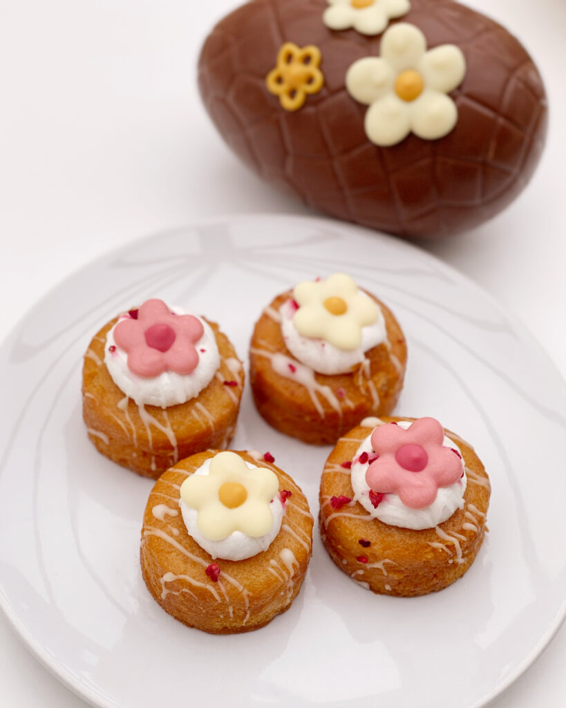 Piped chocolate flower decorations on some mini cakes and an Easter Egg, by For Creatives' Sake