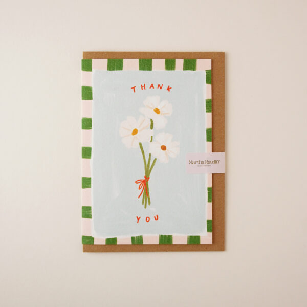 Thank you floral illustrated card by Martha Ratcliff Illustration, with an illustration of three white daisy flowers tied together and a checked green and cream border on the front. The envelope is brown kraft.